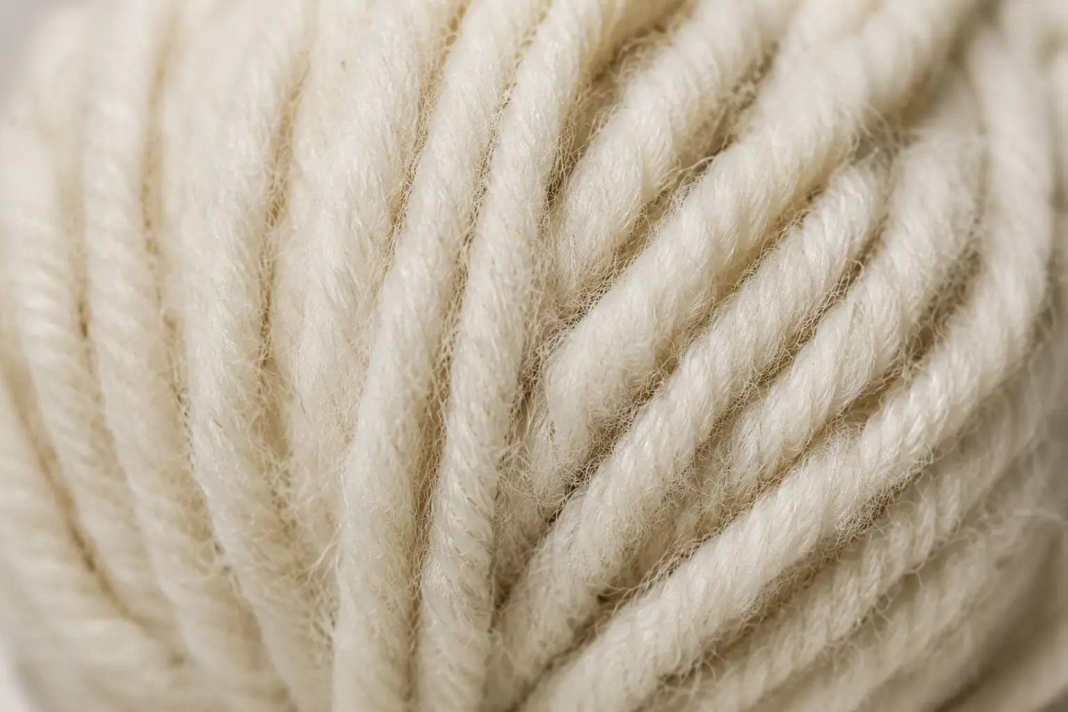 Natural wool yarn showing its soft fibrous texture